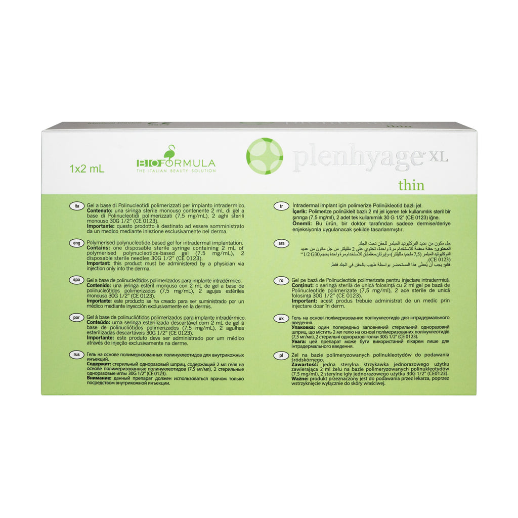 Green and white packaging of a dental product with text and branding.