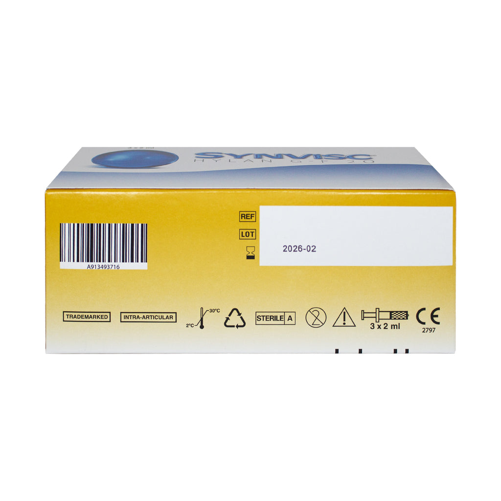 A yellow and white box of Sympec sterile medical supplies, featuring a barcode, lot code 2026-02, and various regulatory icons on a plain white background.